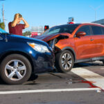 Serious car wreck at intersection due to wrong-way driving