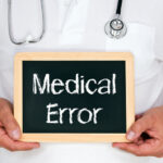 Doctor holding a medical error sign