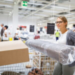 Woman checking out at furniture store