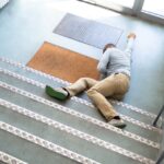 Unconscious Man Lying On Staircase